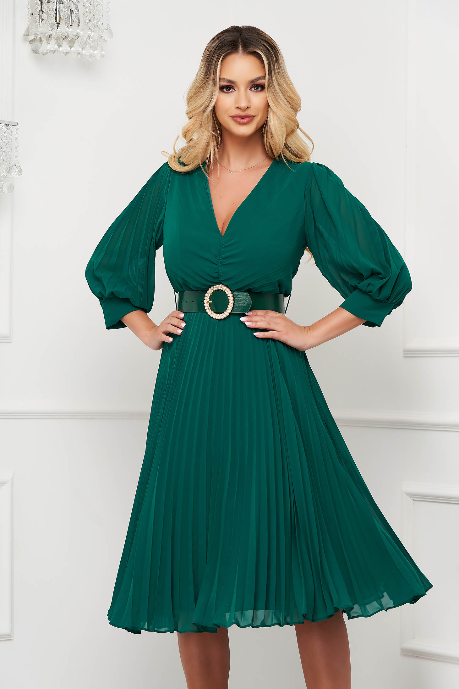 Green dress pleated from veil fabric midi cloche accessorized with belt