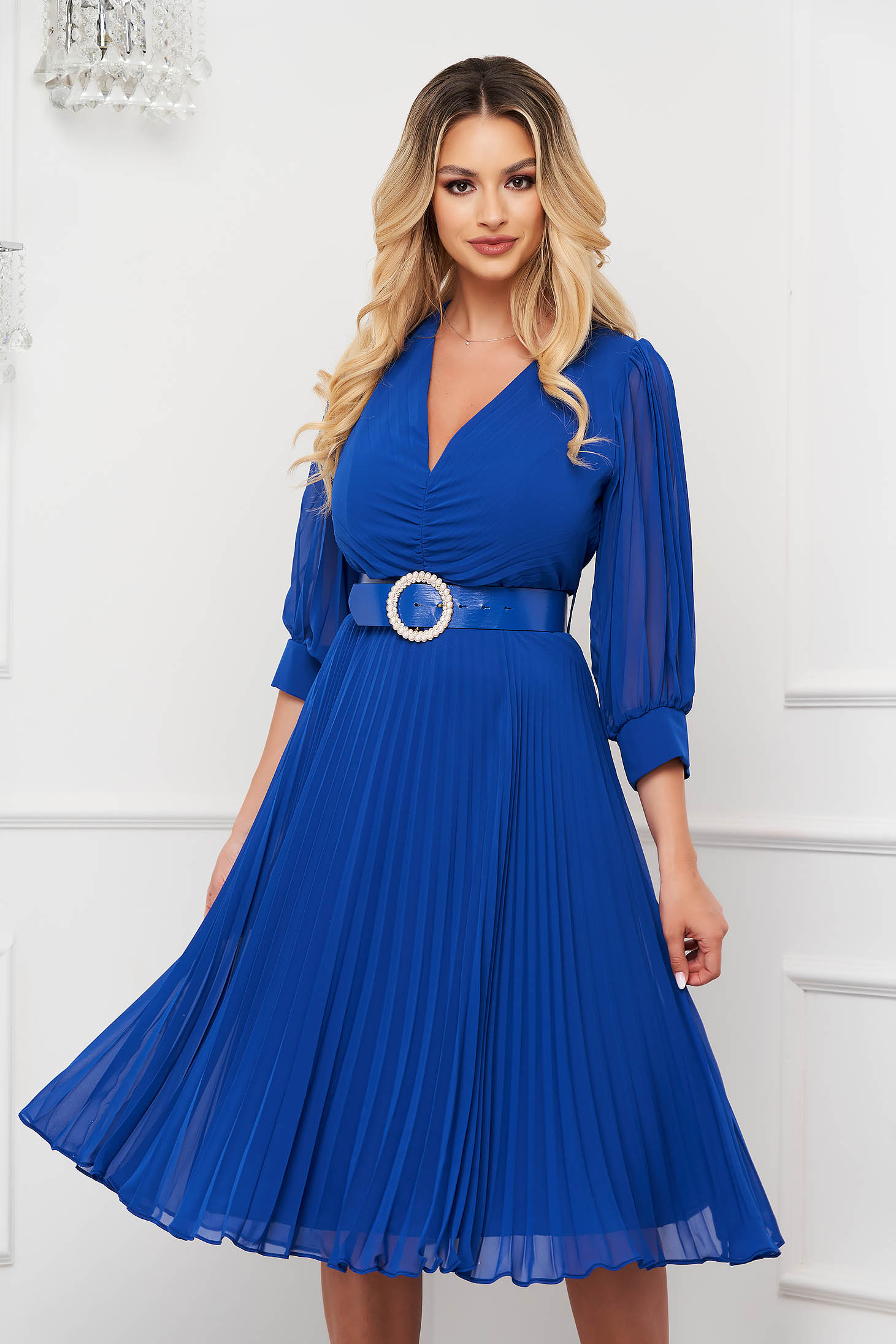 Blue dress pleated from veil fabric midi cloche accessorized with belt