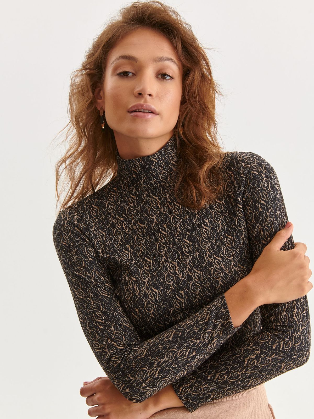 Black women`s blouse tented with turtle neck from elastic fabric