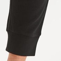 Black trousers conical jersey is fastened around the waist with a ribbon
