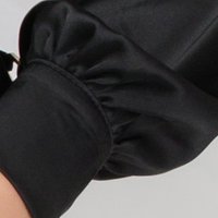Black women`s blouse from satin loose fit roll-neck