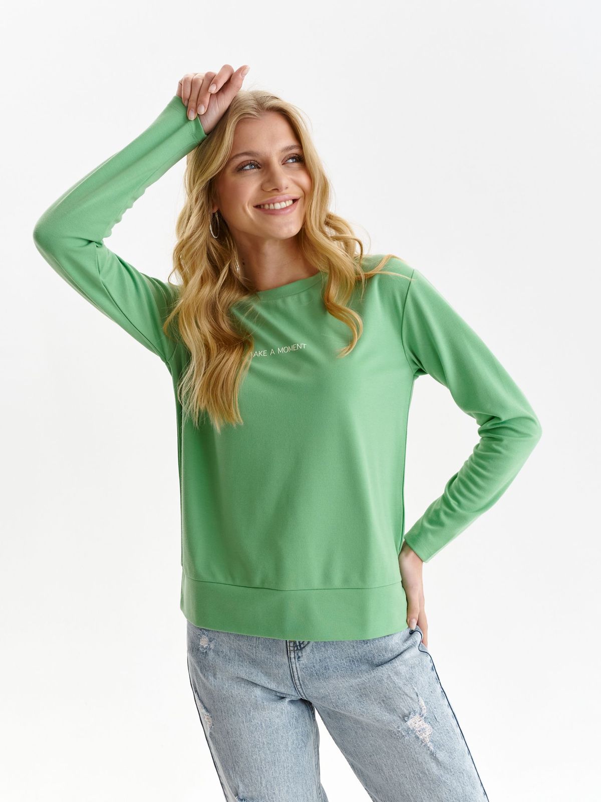 Green women`s blouse from elastic fabric loose fit