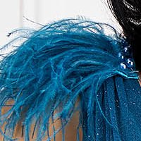 Petrol blue glitter tulle dress long in flared style with feathers on the shoulders