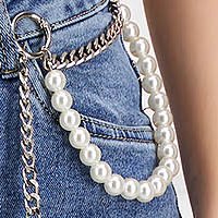 Blue jeans denim skinny jeans accessorized with chain