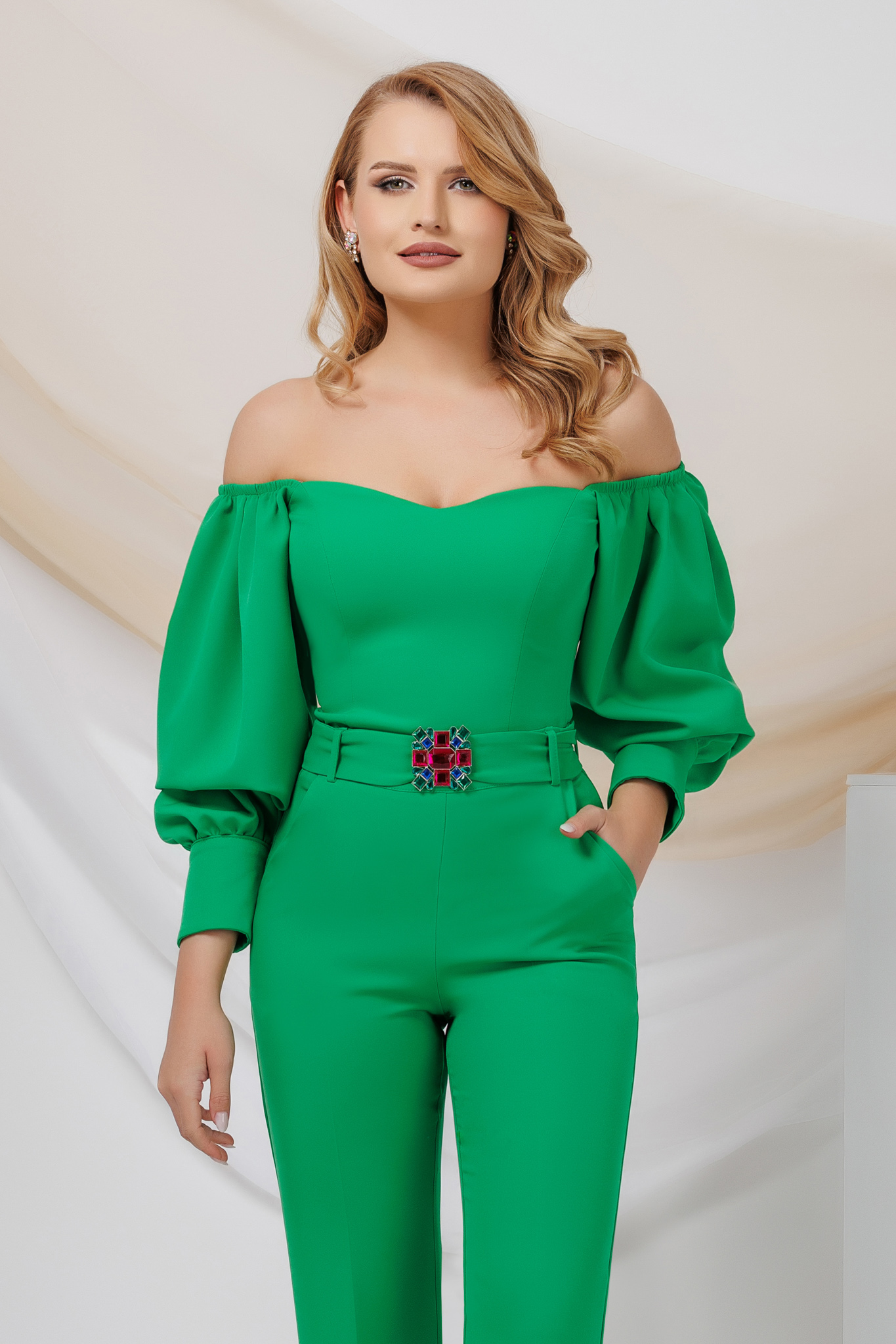 Green women`s blouse from satin with puffed sleeves naked shoulders