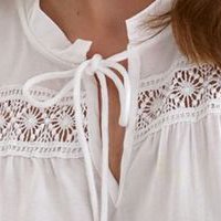 White women`s blouse light material loose fit with embroidery details