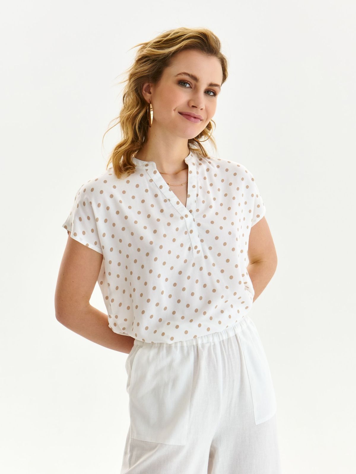 White women`s blouse light material loose fit with v-neckline with dots print