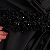 Long black taffeta dress with crossover neckline and embossed flowers at the waist