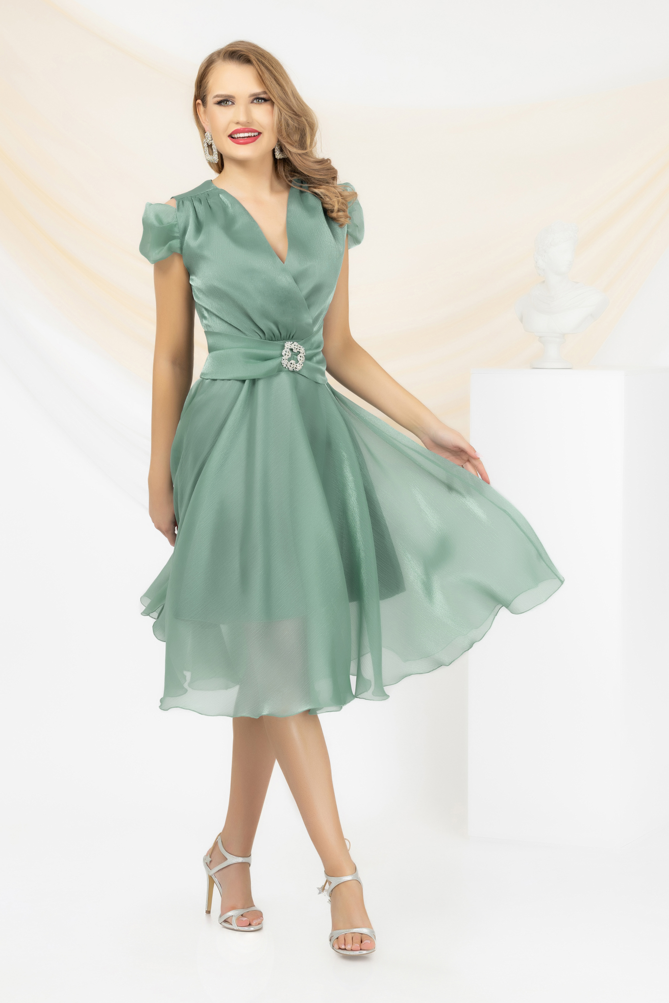 Mint dress from veil fabric accessorized with tied waistband strass