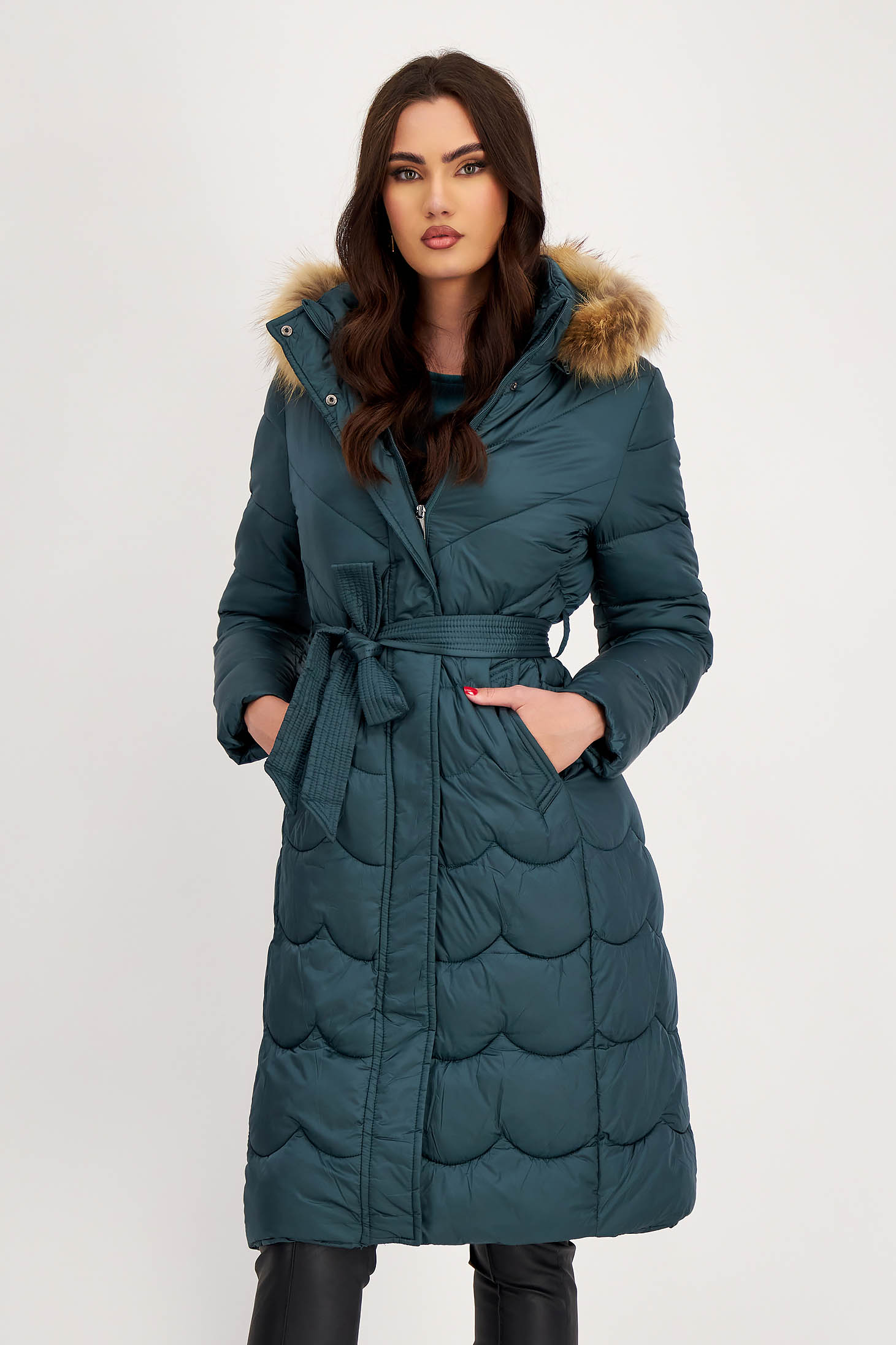 Dark green long shell jacket with a straight cut accessorized with natural fur on the hood