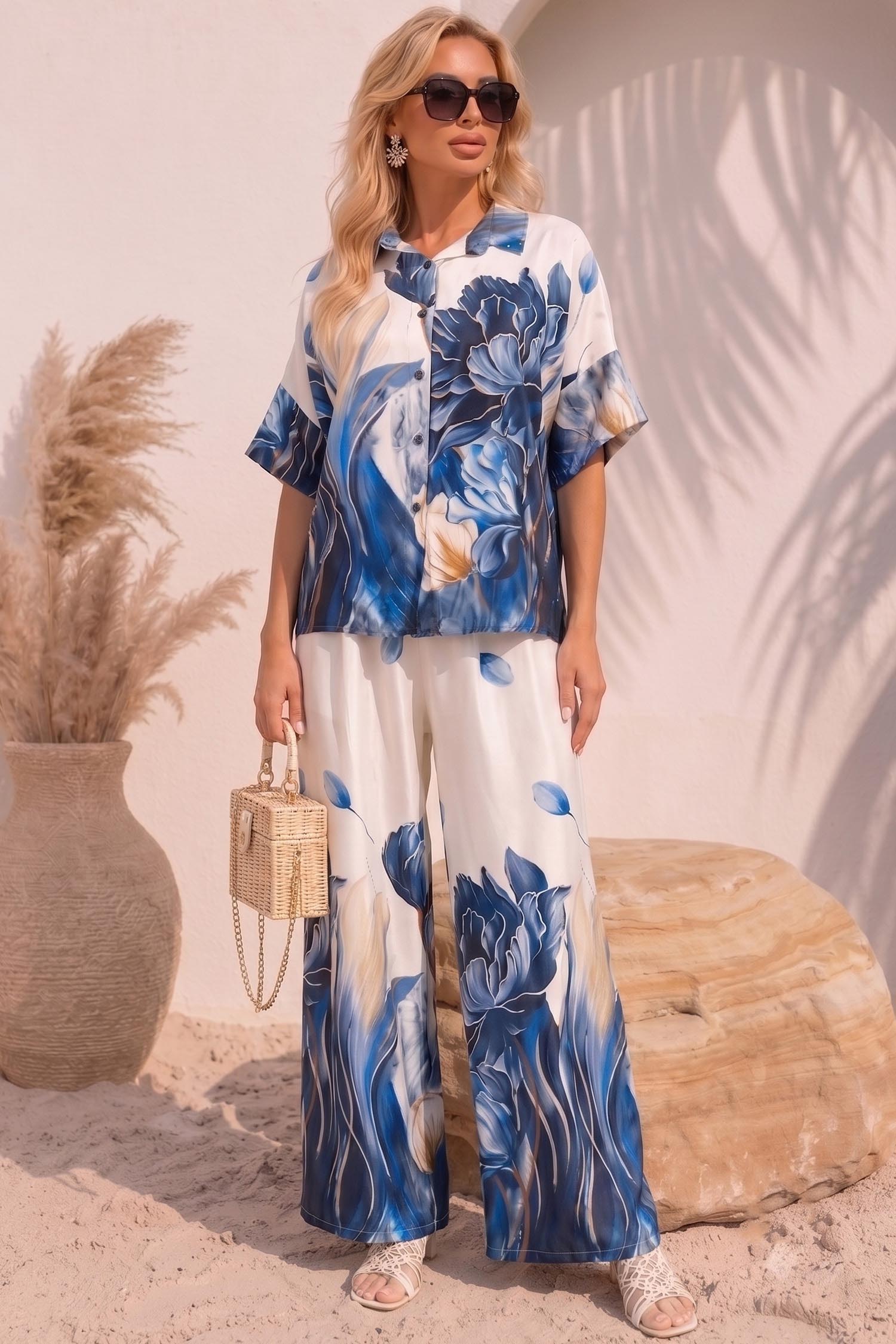 Compleu din material fluid albastru cu un croi larg si imprimeu floral 1 - StarShinerS.ro
