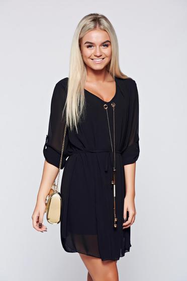 Black elegant easy cut dress with metalic accessory