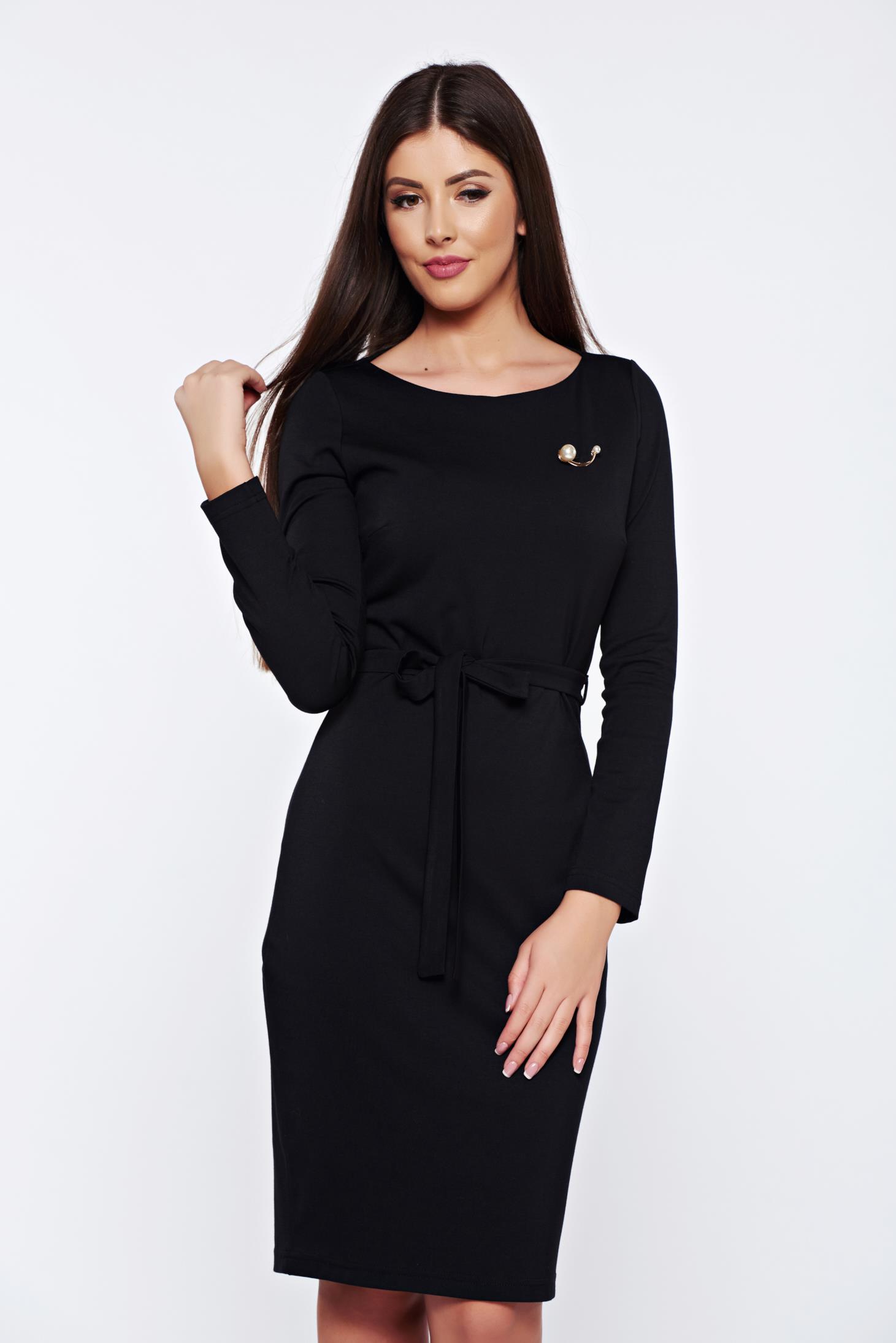 PrettyGirl black office dress accessorized with breastpin