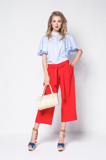 PrettyGirl red high waisted flaring cut trousers accessorized with tied waistband
