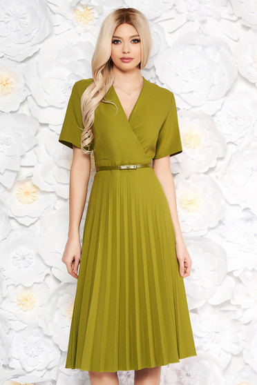 Green dress pleats of material with v-neckline flaring cut