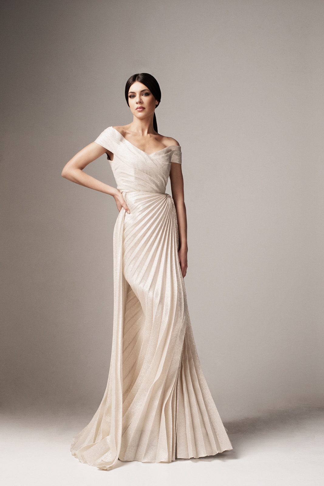 Mermaid style dress made of shiny gold material with v-neckline on the shoulders - Ana Radu