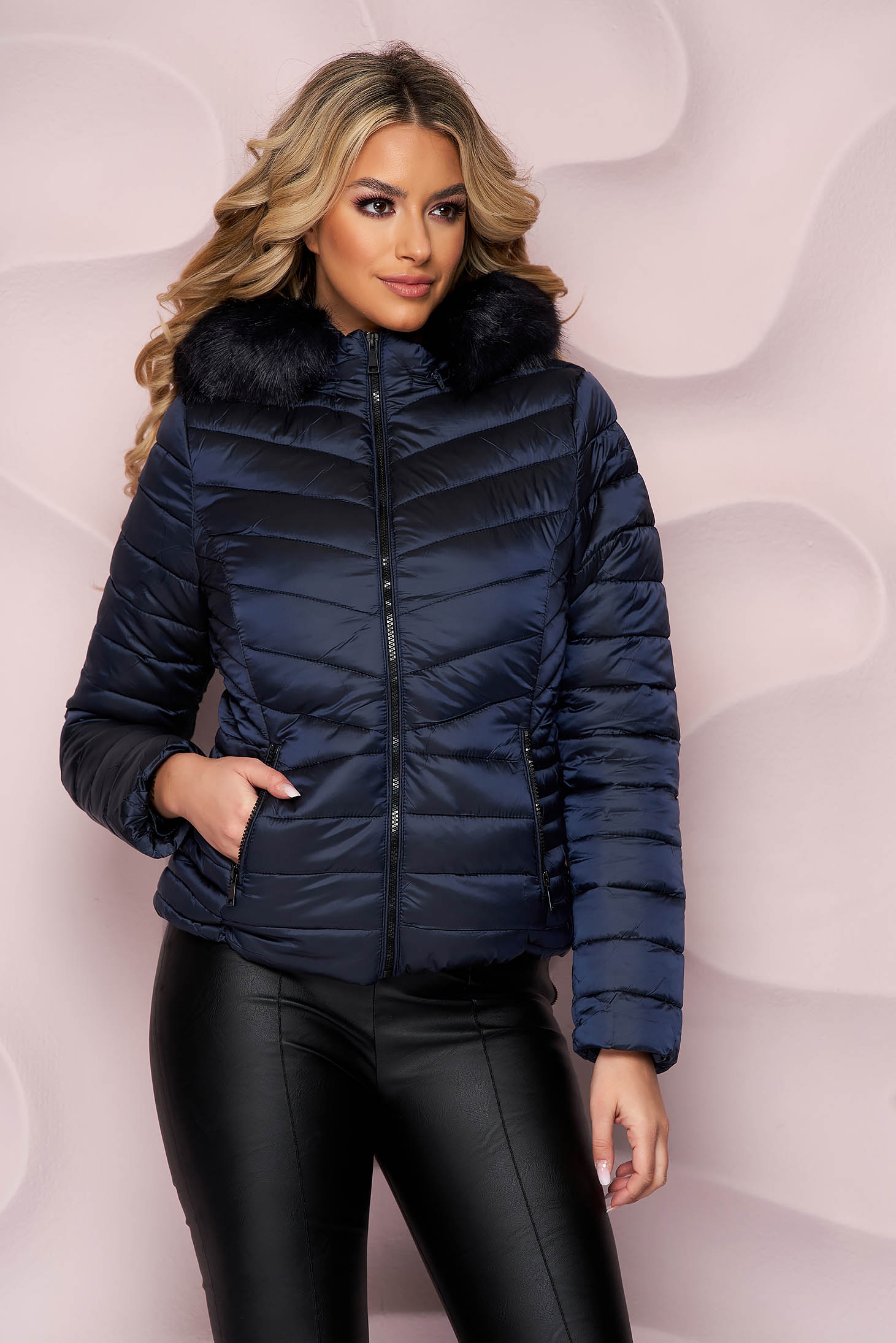 Darkblue jacket tented from slicker with furry hood
